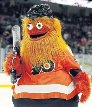  ?? TOM MIHALEK THE ASSOCIATED PRESS ?? With their new mascot, Gritty, it’s as if the Philadelph­ia Flyers tried to be first in the Creepy Dept.