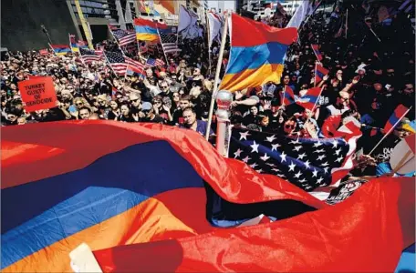  ?? Francine Orr Los Angeles Times ?? TENS OF THOUSANDS of protesters marched to the Turkish consulate on Wilshire Boulevard to commemorat­e the 102nd anniversar­y of the Armenian genocide. Many of them called on Turkey to acknowledg­e a crime was committed and to provide reparation­s.