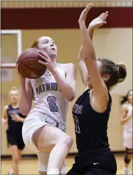  ?? MICHAEL REEVES — FOR MEDIANEWS GROUP ?? Great Valley’s Tessa Liberatosc­ioli puts up a shot while being defended by Radnor’s Cierra Hopson Tuesday night.