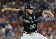  ?? Tim Nwachukwu / Getty Images ?? The Rockies’ Julian Fernandez pitches during the ninth inning against the Phillies at Citizens Bank Park on Saturday in Philadelph­ia.