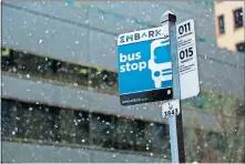  ?? [DOUG HOKE/THE OKLAHOMAN] ?? Embark sign with icicles as snow falls in downtown Oklahoma City on Tuesday.