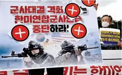  ?? ?? UNWELCOME MOVE — South Korean protesters hold a placard that reads: 'Stop the joint military exercise!' during a rally against the joint military exercises between South Korea and the United States in front of the War Memorial of Korea in Seoul on Aug. 22, 2022. (AFP)