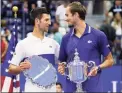  ?? John Minchillo / Associated Press ?? Novak Djokovic, left, and Daniil Medvedev, talk during the trophy ceremony after the men's singles final at the U.S. Open on Sunday.