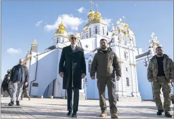  ?? EVAN VUCCI — THE ASSOCIATED PRESS ?? President Biden walks with Ukrainian President Volodymyr Zelenskyy at St. Michael’s Golden-Domed Cathedral on a surprise visit to Kyiv.