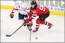  ??  ?? Washington Capitals’ Justin Schultz (2) fights for control of the puck with New Jersey Devils’ Jesper Boqvist (90) during the first period of an NHL hockey game, on April 4, in Newark, NJ. (AP)