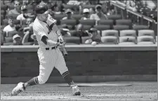  ?? MARK LENNIHAN/AP PHOTO ?? The Mets’ Todd Frazier hits a two-run double Thursday against the Padres during the first inning at Citi Field in New York.