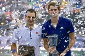  ?? GETTY IMAGES ?? Federer and Alexander Zverev, of Germany, produced an entertaini­ng tennis exhibition series in South America.