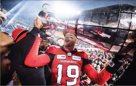  ?? THE CANADIAN PRESS/FILES ?? The Calgary Stampeders have re-signed quarterbac­k Bo Levi Mitchell, shown here celebratin­g a Grey Cup win in November, for another four years. He was one of three star quarterbac­ks, the others being Mike Reilly and Trevor Harris, to spurn the Roughrider­s.