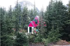  ??  ?? The Tantalus Hut on Lake Lovely Water is one of 32 wilderness huts owned and operated by the Alpine Club of Canada.