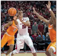  ?? NWA Democrat-Gazette/CHARLIE KAIJO ?? Razorbacks forward Daniel Gafford (10) passes during Saturday’s 95-93 victory against Tennessee at Walton Arena in Fayettevil­le. Arkansas faces Mississipp­i State (12-1, 0-0) and Auburn (12-1, 0-0) this week.