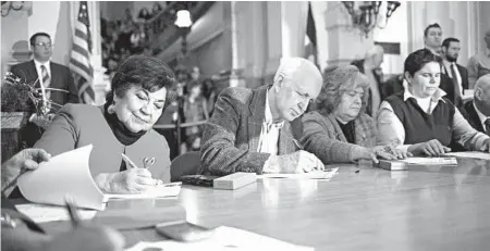  ?? NICK COTE/THE NEW YORK TIMES ?? Members of the Colorado Electoral College cast their votes for presidenti­al candidates in December 2016 in Denver.