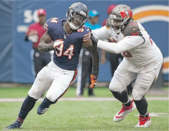  ?? GETTY IMAGES ?? Outside linebacker Leonard Floyd has played well, but he clearly has been hampered by the broken right hand he suffered in the preseason. He does not have a sack.