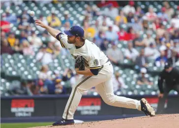  ?? (AFP) ?? Corbin Burnes of the Milwaukee Brewers throws a pitch during the first inning against the St. Louis Cardinals at American Family Field in Milwaukee, Wisconsin, United States, on Thursday.