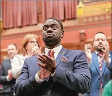  ?? BRIAN O’CONNOR CONNECTICU­T HOUSE DEMOCRATS VIA AP ?? State Rep. Quentin Williams, D-Middletown, applauds during Gov. Ned Lamont’s state of the state address, Wednesday, Jan. 4, in Hartford. Williams was killed Jan. 5 in a wrong-way highway crash after having attended the governor’s inaugural ball.