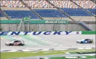  ?? Mark Humphrey / Associated Press ?? Cole Custer crosses the finish line ahead of Martin Truex Jr. to win the Quaker State 400 on Sunday.