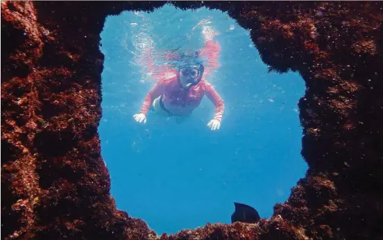  ?? PHOTOS BY DOUG HANSEN/SAN DIEGO UNION-TRIBUNE ?? Visitors can snorkel among the rusty ruins of a WWII Japanese supply ship.