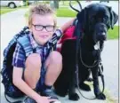  ?? THE CANADIAN PRESS FILE PHOTO ?? Student Kenner Fee is aided by his service dog, Ivy, but can’t bring him to school.