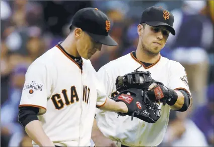  ?? NHATV. MEYER/ STAFF ?? Tim Lincecum, left, taps gloves with Buster Posey after the Giants turned a double play to end the first inning against the Dodgers.