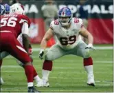  ?? RICK SCUTERI — THE ASSOCIATED PRESS FILE ?? In this file photo, New York Giants center Brett Jones (69) works at the line of scrimmage during the team’s NFL football game against the Arizona Cardinals in Glendale, Ariz.