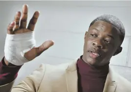  ?? AP PHOTOS ?? QUICK ACTION: James Shaw Jr., above, shows his hand that was injured when he disarmed a shooter inside a Waffle House. Police are searching for Travis Reinking, below.