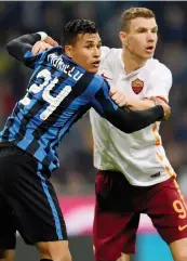  ?? GETTY IMAGES ?? Jeison Murillo, 23 anni, lotta con Edin Dzeko (29)