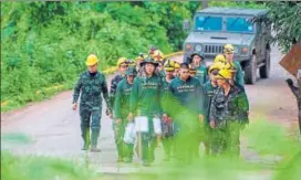  ?? AFP ?? Thai soldiers walk out from the Tham Luang cave area during rescue operations.