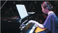  ?? — THE ASSOCIATED PRESS ?? Japanese pianist Kaoru Imahigashi plays during a concert to mark the debut of Gaza’s only grand piano after it was rescued from conflict.