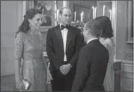  ?? AP/ERIC FEFERBERG ?? Kate, the Duchess of Cambridge (left), and Prince William are greeted by the British ambassador to France, Lord Ed Llewellyn and his wife, Anne, as they arrive for a dinner Friday at the British Embassy in Paris.