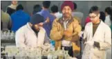  ?? RAJ K RAJ/HT PHOTO ?? Sodhi (middle) with two of his students..
Chemical methods that react with insoluble contents of the sweat or very little water to give coloured impression­s. It can be used if the print is sprinkled with water, buried in soil, or burnt.
