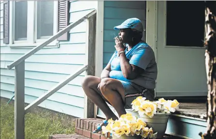  ?? KATE MEDLEY/THE NEW YORK TIMES ?? Marilyn Hoffman sits outside her rented home in Sanford, North Carolina on Sept. 11. Hoffman lost her job as an aide at a group home for mentally disabled adults and is now facing eviction.