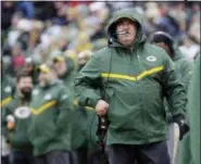  ?? MIKE ROEMER — THE ASSOCIATED PRESS ?? Packers coach Mike McCarthy watches a replay on the scoreboard during the first half against the Arizona Cardinals Sunday in Green Bay, Wis.