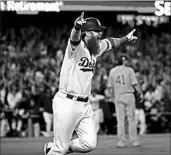  ?? NUCCIO DINUZZO/CHICAGO TRIBUNE ?? Justin Turner lets out a yell as he rounds the bases after hitting a game-winning three-run homer for the Dodgers.