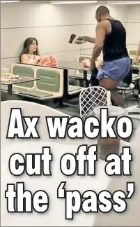  ?? ?? SCARY: A man brandishin­g an ax stands threatenin­gly over a woman at a Lower East Side McDonald’s on Friday.