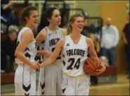  ?? AUSTIN HERTZOG - MEDIANEWS GROUP ?? Pottsgrove players, from left, Sydney Mowery, Sierra Potts and Riley Simon celebrate after defeating Phoenixvil­le 5939 to win the PAC Frontier Division title Friday.