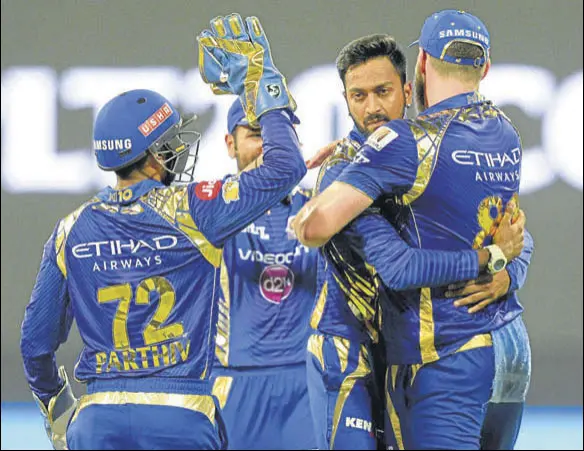 ??  ?? Krunal Pandya (second from right) has set the platform for pace bowlers Jasprit Bumrah and Mitchell McClenagha­n to operate with very little pressure on them.