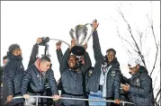  ?? JASON GETZ / SPECIAL TO THE AJC ?? Atlanta United midfielder Darlington Nagbe holds up the MLS Cup as he celebrates with fellow teammates during the victory rally in December.