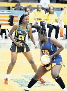  ?? FILE ?? Sunshine Girl Nicole Aiken (left) guards a Barbados player in a series in 2015.