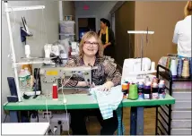  ?? GARY FOURNIER — SENTINEL & ENTERPRISE ?? Female entreprene­ur and humanitari­an Vinda Pedroso, owner of three tailoring businesses in the Twin Cities, works on some clothing at her recently opened community sewing center Vinda’s Closet on Central Street in Leominster, where she offers free sewing lessons.
