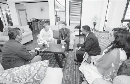  ?? ?? President Irfaan Ali (second from right) meeting with the team. (Office of the President photo)