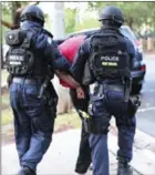  ?? AFP ?? Police make an arrest in a counter-terrorism operation in Sydney last year.