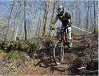 ?? STAFF PHOTO BY MARK PACE ?? Harley Addair of North Carolina competes Saturday in the Downhill Southeast mountain bike series at Trials Training Center in Sequatchie, Tenn. The race was the first leg in the annual series.
