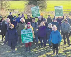  ?? ?? A protest against the developmen­t by campaign group Save Our Heathlands