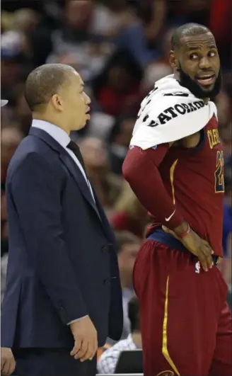  ?? TONY DEJAK — ASSOCIATED PRESS ?? LeBron James talks with Coach Tyronn Lue during the first half against the Bulls on Oct. 24. The Cavaliers have lost six of eight and are 4-6 on the season.