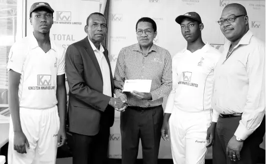  ??  ?? JCA President Wilford ‘Billy’ Heaven (second left) receives the sponsorshi­p cheque from Kingston Wharves Limited CEO Grantley Stephenson (centre). Sharing in the moment (from left) are Lucas Under-15 Captain Malik Miller, St Thomas Under-15 Vice-Captain Jacquan Taylor, and JCA CEO Courtney Francis.