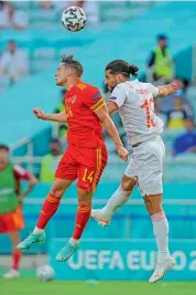  ?? AP ?? Connor Roberts (left) of Wales and Switzerlan­d’s Ricardo Rodriguez vie for the ball during their Euro Group ‘A’ match at the Baku Olympic stadium in Baku, Azerbaijan, on Saturday. —