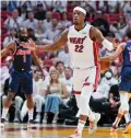  ?? WILFREDO LEE/ASSOCIATED PRESS ?? Miami Heat forward Jimmy Butler celebrates after scoring during the first half of Game 5 of a second-round playoff series Tuesday against the Philadelph­ia 76ers in Miami. Butler ended with 23 points.