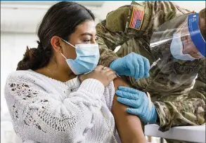  ?? DANIEL A. VARELA dvarela@miamiheral­d.com ?? Hannah Sielk is vaccinated at Miami Dade College’s North Campus on March 6. The FDA says the protection provided by COVID-19 vaccines should last at least nine months.