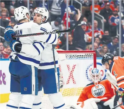  ?? CURTIS COMEAU GETTY IMAGES ?? John Tavares celebrates with Zach Hyman after scoring the Leafs’ second goal. Tavares was in on all the scoring in a 3-2 win.