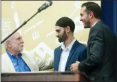  ??  ?? Hamid Hayat’s attorney, Dennis Riordan, left, speaks to him, while Basim Elkarra listens at right.