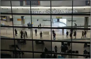  ?? (AP) ?? People mill about the arrivals area at Heathrow Airport in London, during England’s coronaviru­s lockdown in January.